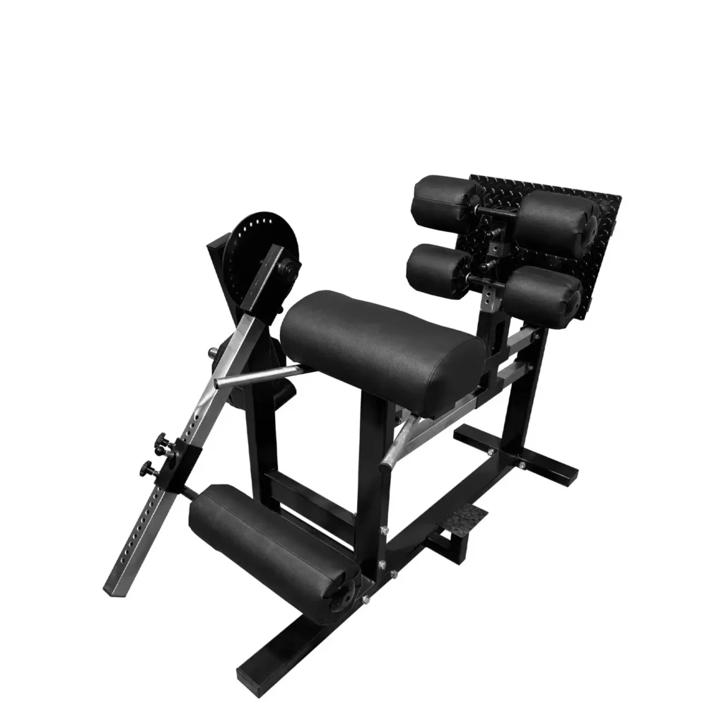 A side-angle view of the L4X inverse curl gym machine showcasing its robust red and black steel frame. The machine features a padded thigh support, adjustable foot rollers, and a sturdy diamond-plated footplate for maximum stability. This gym machine is designed for hamstring and glute development and provides a secure and comfortable setup for advanced strength training exercises.