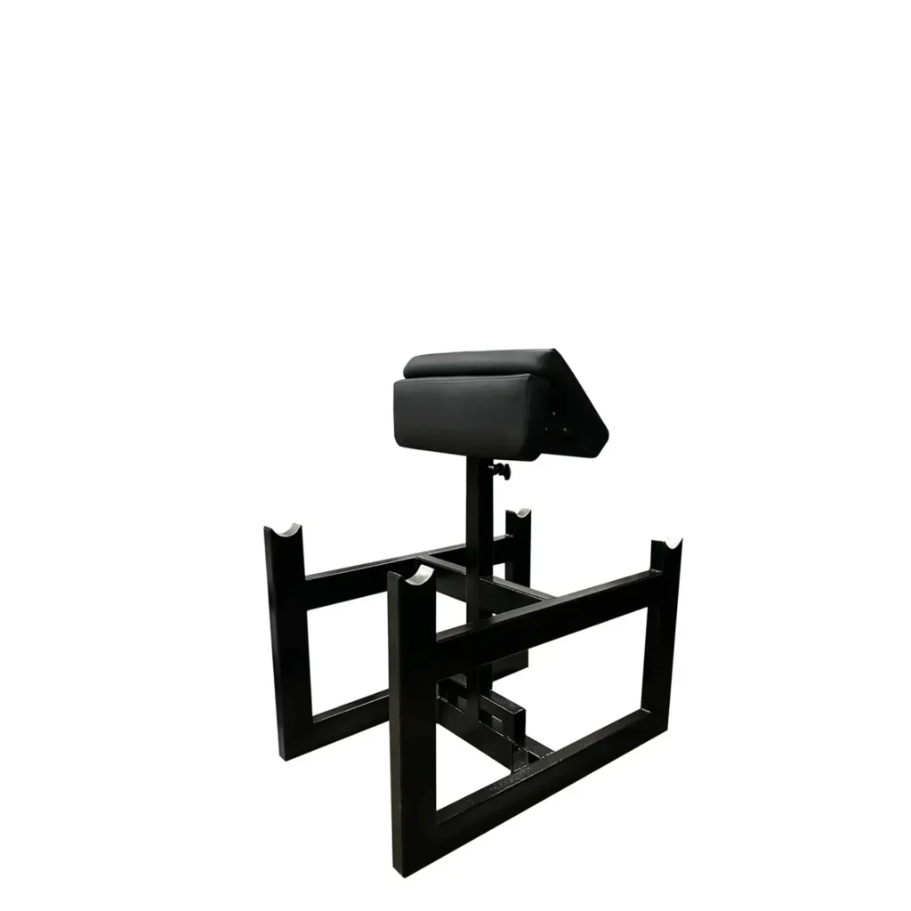 Strength training equipment at home features a fully loaded two-sided Scott bench with weight-loaded barbells, a thick padded support cushion, and a sturdy black steel frame set up for arm training.