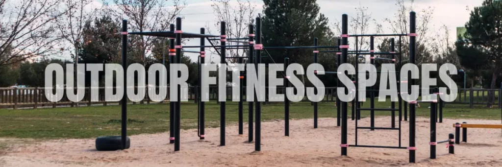 Outdoor fitness park featuring calisthenics structures and monkey bars designed for full-body workouts using durable outdoor fitness equipment.